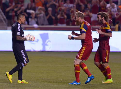 Leah Hogsten  |  The Salt Lake Tribune
Real Salt Lake goalkeeper Nick Rimando (18) celebrates his new MLS record for career game shutouts at 113 with Real Salt Lake defender Nat Borchers (6) and Real Salt Lake midfielder Kyle Beckerman (5). 
Real Salt Lake defeated D. C. United 3-0 Saturday, August 9, 2014, at Rio Tinto Stadium.