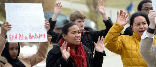 Al Hartmann  |  The Salt Lake Tribune
About 75 University of Utah students rallied in support of Michael Brown and Ferguson protesters at the Marriott Library plaza Monday Dec. 1, 2014. The protest was largely organized via Twitter using the hashtag handsupwalkout. This was part of a nationwide protest.