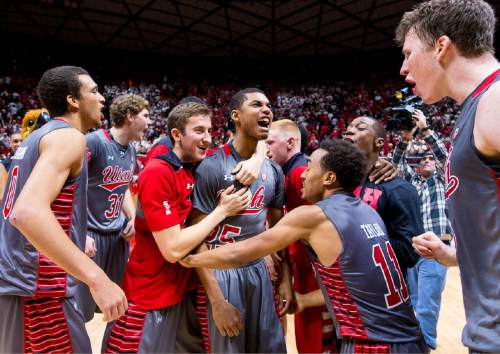 Trent Nelson  |  The Salt Lake Tribune
Utah players celebrate after defeating the Wichita State Shockers in overtime, 69-68, college basketball at the Huntsman Center in Salt Lake City, Wednesday December 3, 2014. At center is Utah Utes guard Kenneth Ogbe (25).