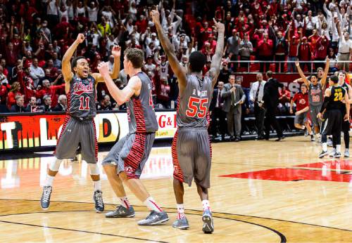 Trent Nelson  |  The Salt Lake Tribune
Utah Utes guard Brandon Taylor (11), Jakob Poeltl and Delon Wright celebrate as the University of Utah Utes defeats the Wichita State Shockers in overtime, 69-68, college basketball at the Huntsman Center in Salt Lake City, Wednesday December 3, 2014. At right is Utah Utes guard Delon Wright (55).