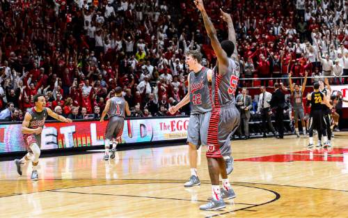 Trent Nelson  |  The Salt Lake Tribune
Utah Utes guard Brandon Taylor (11), Jakob Poeltl and Delon Wright celebrate as the University of Utah Utes defeats the Wichita State Shockers in overtime, 69-68, college basketball at the Huntsman Center in Salt Lake City, Wednesday December 3, 2014. At right is Utah Utes guard Delon Wright (55).