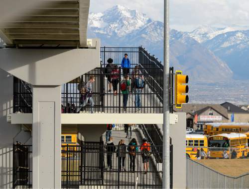 Trent Nelson  |  The Salt Lake Tribune
Students walk home on an overpass after a day of classes at Sunset Ridge Middle School in West Jordan, Friday December 5, 2014. The City of West Jordan, City of South Jordan and Herriman City held a joint press conference to discuss their opposition to a  proposed relocation of the state prison to West Jordan. The proposed location is 9000 South and 7300 West.