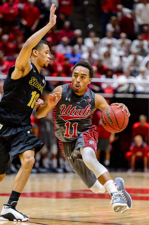 Trent Nelson  |  The Salt Lake Tribune
Wichita State Shockers guard Ria'n Holland (10) defends Utah Utes guard Brandon Taylor (11) as the University of Utah Utes host the Wichita State Shockers, college basketball at the Huntsman Center in Salt Lake City, Wednesday December 3, 2014.