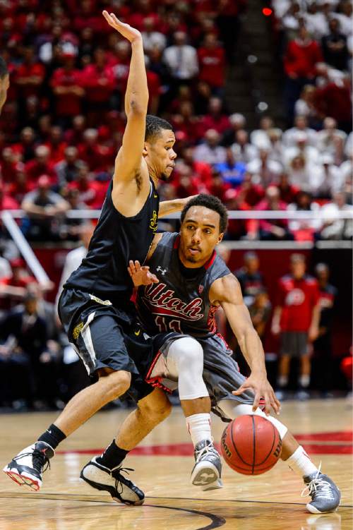 Trent Nelson  |  The Salt Lake Tribune
Wichita State Shockers guard Ria'n Holland (10) defends Utah Utes guard Brandon Taylor (11) as the University of Utah Utes host the Wichita State Shockers, college basketball at the Huntsman Center in Salt Lake City, Wednesday December 3, 2014.