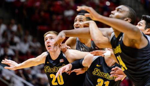 Trent Nelson  |  The Salt Lake Tribune
Utah Utes forward Kyle Kuzma (35, center) gets boxed out on a free throw as the University of Utah Utes host the Wichita State Shockers, college basketball at the Huntsman Center in Salt Lake City, Wednesday December 3, 2014. Wichita State Shockers center Rauno Nurger (20) at left.