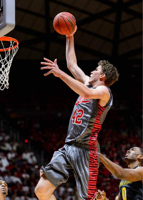 Trent Nelson  |  The Salt Lake Tribune
Utah Utes forward Jakob Poeltl (42) goes up for a dunk as the University of Utah Utes host the Wichita State Shockers, college basketball at the Huntsman Center in Salt Lake City, Wednesday December 3, 2014.