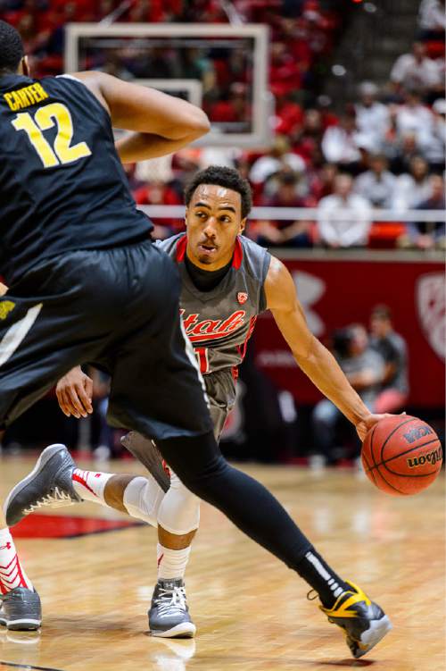 Trent Nelson  |  The Salt Lake Tribune
Utah Utes guard Brandon Taylor (11) defended by Wichita State Shockers forward Darius Carter (12) as the University of Utah Utes host the Wichita State Shockers, college basketball at the Huntsman Center in Salt Lake City, Wednesday December 3, 2014.