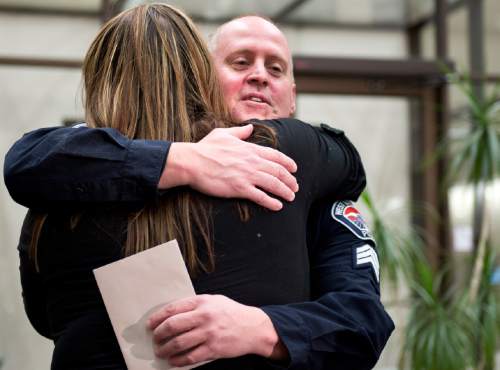 Lennie Mahler  |  The Salt Lake Tribune
Shara Bailey hugs and thanks Sgt. Shane Matheson during a press conference at West Valley City Hall on Saturday, Dec. 6, 2014. Matheson and his K9 dog, Copper, found missing Kollin Bailey, 6, stuck in a manhole Friday.