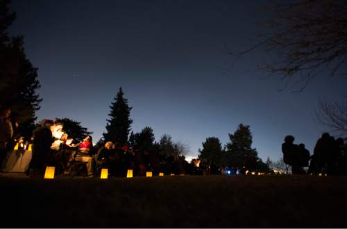 Rick Egan  |  The Salt Lake Tribune

Participants pause for a moment of silence during the annual ceremony for grieving parents at the Christmas Box Angel, at the Salt Lake City Cemetery, Saturday, December 6, 2014