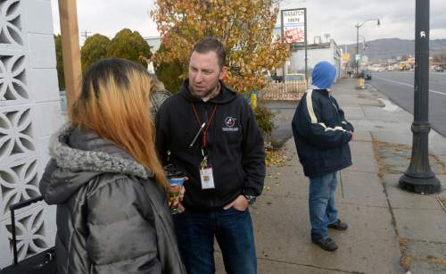 Al Hartmann  |  The Salt Lake Tribune
Phil Taylor, nurse practitioner for the Fourth Street Clinic talks to homeless people along State Street in Salt Lake City Wednesday December 4.  He operates the clinic's mobile medical van but much of his work is talking to homeless, earning their trust and explaining the medical services provided by the clinic.