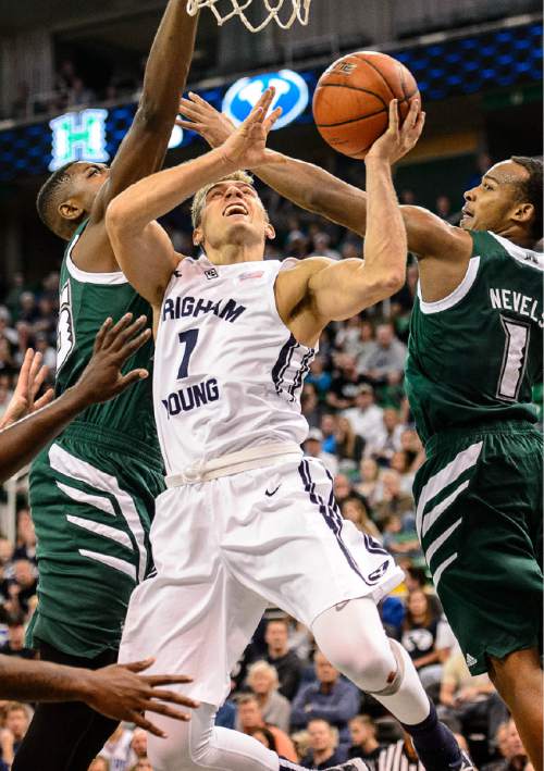 Trent Nelson  |  The Salt Lake Tribune
Brigham Young Cougars guard Chase Fischer (1) is fouled by Hawaii Warriors guard Garrett Nevels (1) as BYU faces Hawaii, college basketball at EnergySolutions Arena in Salt Lake City, Saturday December 6, 2014.