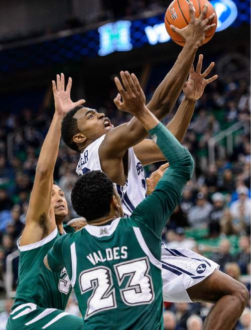 Trent Nelson  |  The Salt Lake Tribune
Brigham Young Cougars guard Anson Winder (20) shoots over Hawaii Warriors guard Aaron Valdes (23) as BYU faces Hawaii, college basketball at EnergySolutions Arena in Salt Lake City, Saturday December 6, 2014.