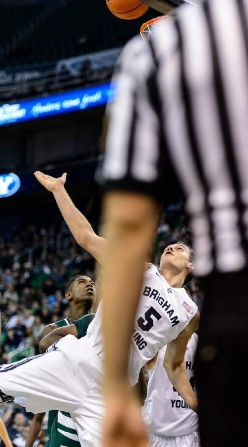 Trent Nelson  |  The Salt Lake Tribune
Brigham Young Cougars guard Kyle Collinsworth (5) puts up a shot as BYU faces Hawaii, college basketball at EnergySolutions Arena in Salt Lake City, Saturday December 6, 2014.