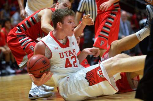 Chris Detrick  |  The Salt Lake Tribune
Utah Utes forward Jakob Poeltl (42) and Pacific Boxers Coby Proctor (2) go for the ball during the game at the Huntsman Center Thursday November 6, 2014.