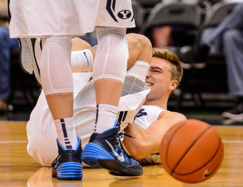 Trent Nelson  |  The Salt Lake Tribune
Brigham Young Cougars guard Jake Toolson (15) in pain after a dive late in the game, as BYU faces Hawaii, college basketball at EnergySolutions Arena in Salt Lake City, Saturday December 6, 2014.