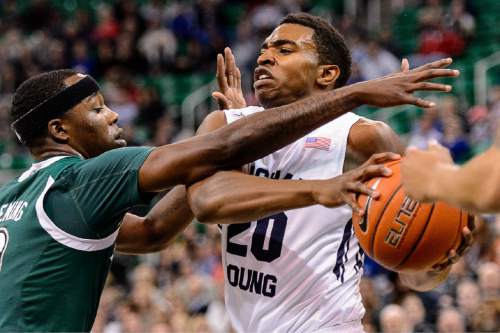 Trent Nelson  |  The Salt Lake Tribune
Brigham Young Cougars guard Anson Winder (20) drives into Hawaii Warriors guard Isaac Fleming (0) as BYU faces Hawaii, college basketball at EnergySolutions Arena in Salt Lake City, Saturday December 6, 2014.