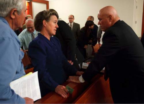 Salt Lake City - FLDS member Mary Harker (left) speaks with Bruce Wisan following a hearing held at the Matheson Courthouse Wednesday, July 29, 2009 to decide on the sale of the Berry Knoll property in the United Effort Plan (UEP) land trust.
Pool/Trent Nelson/The Salt Lake Tribune; 7.29.2009