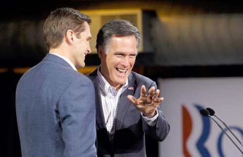 AP File Photo
Republican presidential candidate former Massachusetts Gov. Mitt Romney waves on stage with his son Josh, left, at his Colorado caucus night rally in Denver, Tuesday, Feb. 7, 2012. (AP Photo/Gerald Herbert)