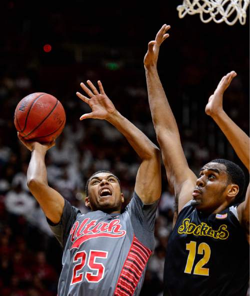 Trent Nelson  |  The Salt Lake Tribune
Utah Utes guard Kenneth Ogbe (25) looks for a shot, defended by Wichita State Shockers forward Darius Carter (12) as the University of Utah Utes host the Wichita State Shockers, college basketball at the Huntsman Center in Salt Lake City, Wednesday December 3, 2014.