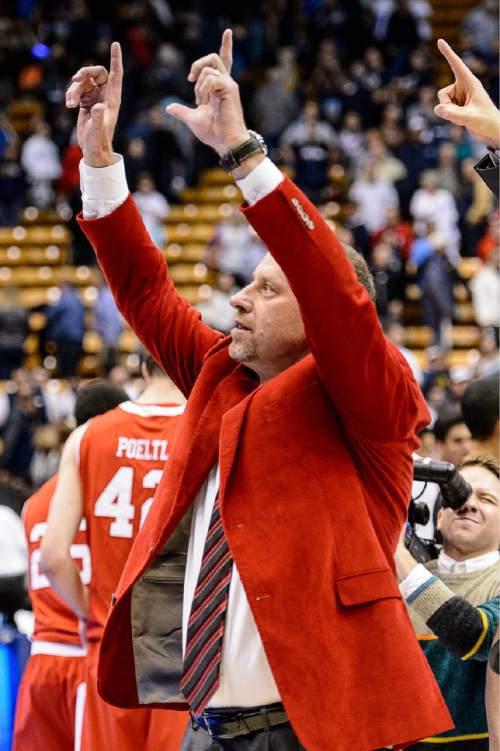 Trent Nelson  |  The Salt Lake Tribune
Utah Utes head coach Larry Krystkowiak celebrates the win as BYU hosts Utah, college basketball at the Marriott Center in Provo, Wednesday December 10, 2014.
