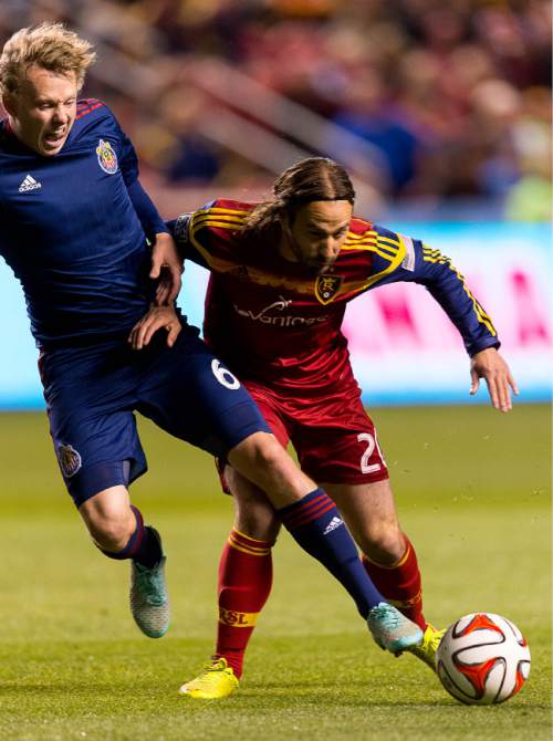 Trent Nelson  |  The Salt Lake Tribune
Chivas USA's Matthew Dunn (6) and Real Salt Lake's Ned Grabavoy (20) fight for the ball as Real Salt Lake faces Chivas USA at Rio Tinto Stadium in Sandy, Wednesday October 22, 2014.