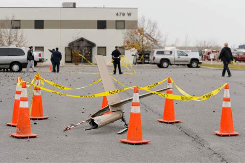 Trent Nelson  |  The Salt Lake Tribune
The tail rotor from a crashed helicopter sits roped off at the scene of a helicopter crash near 500 West 900 North in North Salt Lake, Tuesday December 2, 2014.