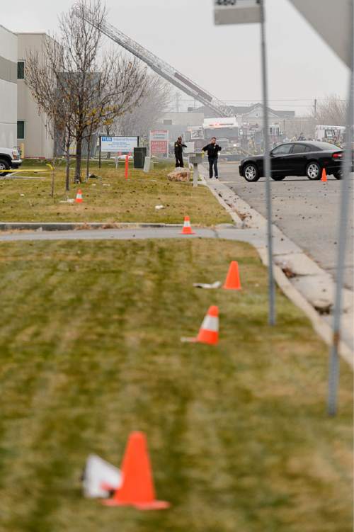 Trent Nelson  |  The Salt Lake Tribune
Emergency crews work the scene of a helicopter crash near 500 West 900 North in North Salt Lake, Tuesday December 2, 2014.