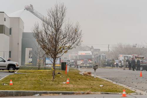 Trent Nelson  |  The Salt Lake Tribune
Emergency crews work the scene of a helicopter crash near 500 West 900 North in North Salt Lake, Tuesday December 2, 2014.