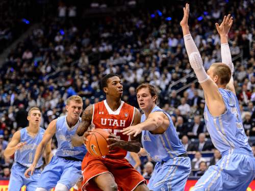 Trent Nelson  |  The Salt Lake Tribune
Utah Utes guard Delon Wright (55) faces a group of BYU defenders as BYU hosts Utah, college basketball at the Marriott Center in Provo, Wednesday December 10, 2014.