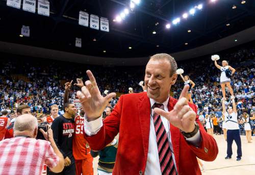 Trent Nelson  |  The Salt Lake Tribune
Utah Utes head coach Larry Krystkowiak flashes a quick "U" after the win as BYU hosts Utah, college basketball at the Marriott Center in Provo, Wednesday December 10, 2014.