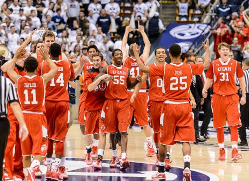 Trent Nelson  |  The Salt Lake Tribune
Utah players celebrate the win as BYU hosts Utah, college basketball at the Marriott Center in Provo, Wednesday December 10, 2014.