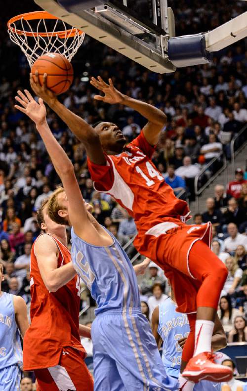 Trent Nelson  |  The Salt Lake Tribune
Utah Utes guard/forward Dakarai Tucker (14) puts up a shot, defended by Brigham Young Cougars forward Isaac Neilson (35) as BYU hosts Utah, college basketball at the Marriott Center in Provo, Wednesday December 10, 2014.