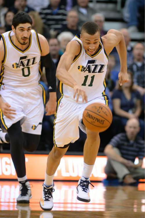 Steve Griffin  |  The Salt Lake Tribune

Utah Jazz guard Dante Exum (11) heads up court after stealing the ball during first half action in the Jazz versus Spurs game at EnergySolutions Arena in Salt Lake City, Tuesday, December 9, 2014.