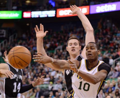 Steve Griffin  |  The Salt Lake Tribune

Utah Jazz guard Alec Burks (10) passes to the wing during first half action in the Jazz versus Spurs game at EnergySolutions Arena in Salt Lake City, Tuesday, December 9, 2014.