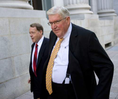 Al Hartmann  |  Tribune file photo
Dewey C. MacKay, right, a Brigham City doctor charged with illegally prescribing millions of pain pills, walks with his lawyer, Peter Stirba, to federal court in Salt Lake City.