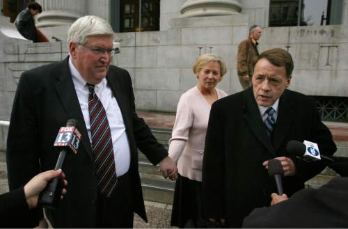 Steve Griffin  |  The Salt Lake Tribune

Dewey C. MacKay holds hands with his wife, Kathleen MacKay, as they leave the Frank E. Moss U.S. Courthouse in Salt Lake City, Utah, Monday Dec. 19, 2011, following sentencing hearing for charges related to prescribing more than 1.9 million hydrocodone pills and nearly 1.6 million oxycodone pills between June 1, 2005, and Oct. 30, 2009. HIs attorney Peter Stirba is at right.