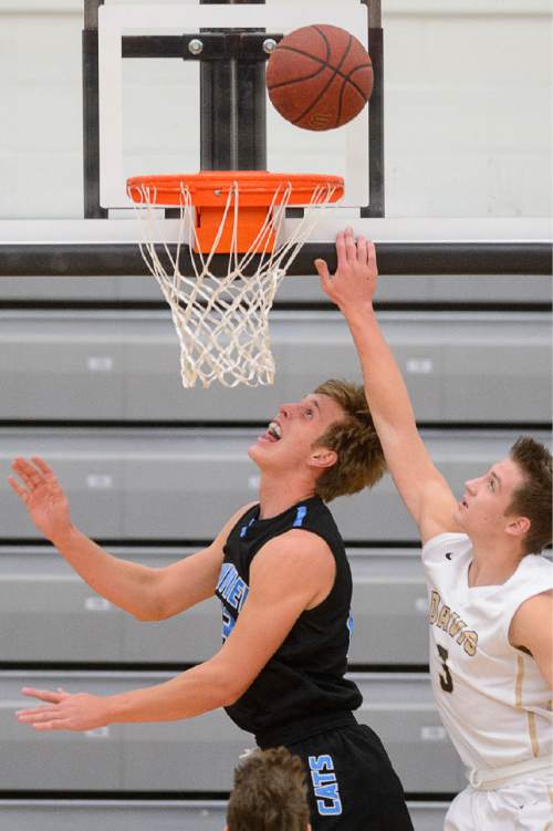 Trent Nelson  |  The Salt Lake Tribune
Sky View's Bryce Mortensen puts up a shot ahead of Davis's Landon Schwartz, as Sky View faces Davis High School in the championship game of the Utah Elite 8 basketball tournament in American Fork, Saturday December 13, 2014.