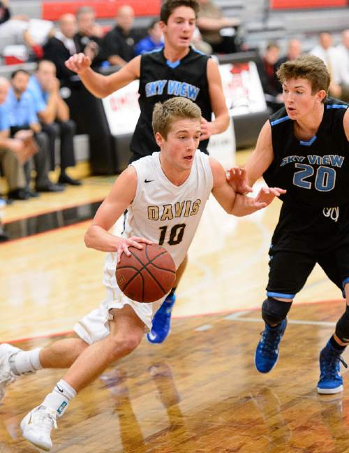 Trent Nelson  |  The Salt Lake Tribune
Davis's Jesse Wade drives to the basket, with Sky View's Jake Hendricks defending, as Sky View faces Davis High School in the championship game of the Utah Elite 8 basketball tournament in American Fork, Saturday December 13, 2014.