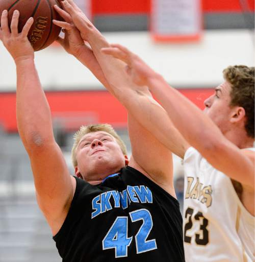 Trent Nelson  |  The Salt Lake Tribune
Sky View's Tyler Downs and Davis's Ben Rigby reach for a rebound as Sky View faces Davis High School in the championship game of the Utah Elite 8 basketball tournament in American Fork, Saturday December 13, 2014.