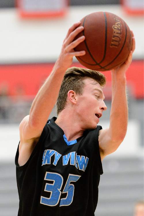Trent Nelson  |  The Salt Lake Tribune
Sky View's Riley Panter grabs a loose ball as Sky View faces Davis High School in the championship game of the Utah Elite 8 basketball tournament in American Fork, Saturday December 13, 2014.