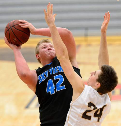 Trent Nelson  |  The Salt Lake Tribune
Sky View's Tyler Downs shoots over Davis's Caleb Leonhardt as Sky View faces Davis High School in the championship game of the Utah Elite 8 basketball tournament in American Fork, Saturday December 13, 2014.