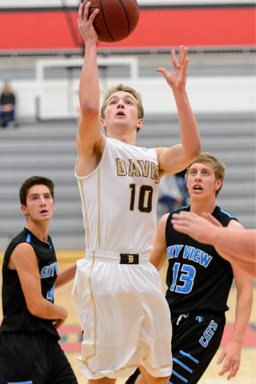 Trent Nelson  |  The Salt Lake Tribune
Davis's Jesse Wade puts up a shot as Sky View faces Davis High School in the championship game of the Utah Elite 8 basketball tournament in American Fork, Saturday December 13, 2014.