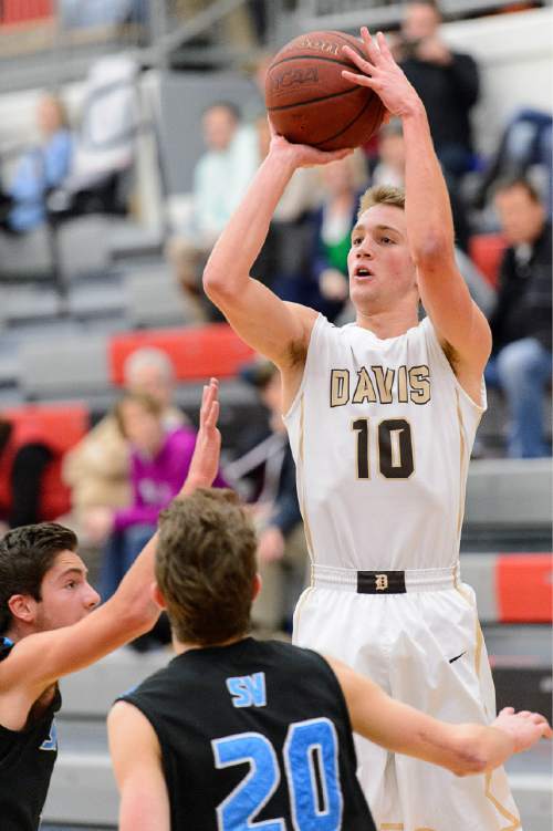 Trent Nelson  |  The Salt Lake Tribune
Davis's Jesse Wade puts up a shot as Sky View faces Davis High School in the championship game of the Utah Elite 8 basketball tournament in American Fork, Saturday December 13, 2014.