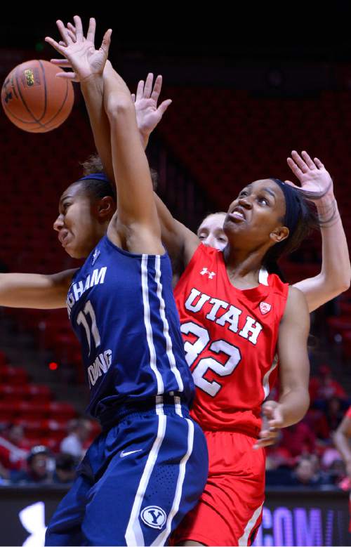 Leah Hogsten  |  The Salt Lake Tribune
Brigham Young Cougars guard Xojian Harry (11) and Utah Utes forward Tanaeya Boclair (32) fight for the rebound. The University of Utah trail Brigham Young University 32-29, Saturday, December 13, 2014 at the Jon M. Huntsman Center.