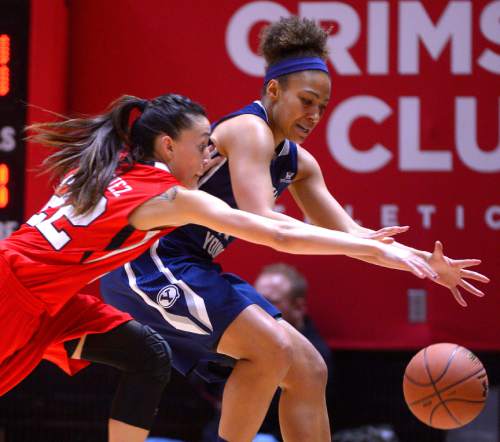 Leah Hogsten  |  The Salt Lake Tribune
Utah Utes guard Danielle Rodriguez (22) and Brigham Young Cougars guard Xojian Harry (11) chase the ball. The University of Utah trail Brigham Young University 32-29, Saturday, December 13, 2014 at the Jon M. Huntsman Center.