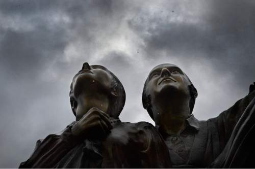 Scott Sommerdorf   |  The Salt Lake Tribune
Figures in the "Duty Triumphs" statues honoring the Mormon Battalion at the This Is The Place heritage park, look upward toward a gently falling snow, Sunday, December 14, 2014.