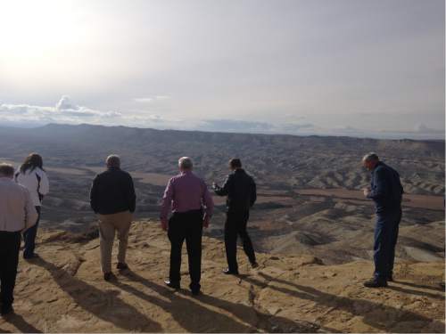 Lee Davidson  |  The Salt Lake Tribune 

A tour of legislators and staff look at overview near new Seep Ridge Road in Uintah County. Officials hope road could be part of highway directly connecting western national parks. Environmentalists say the parks-highway plan is a ruse to benefit the oil and gas industry.
