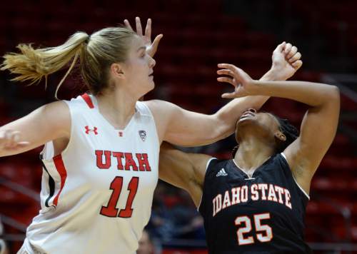 Steve Griffin  |  The Salt Lake Tribune

Utah Utes forward Taryn Wicijowski (11) smacks Idaho State Bengals guard Apiphany Woods (25) in the face with her forearm as the players wrestle for a loose ball during the Utah versus Idaho State women's basketball game at the Huntsman Center on the University of Utah campus in Salt Lake City, Wednesday, December 10, 2014.