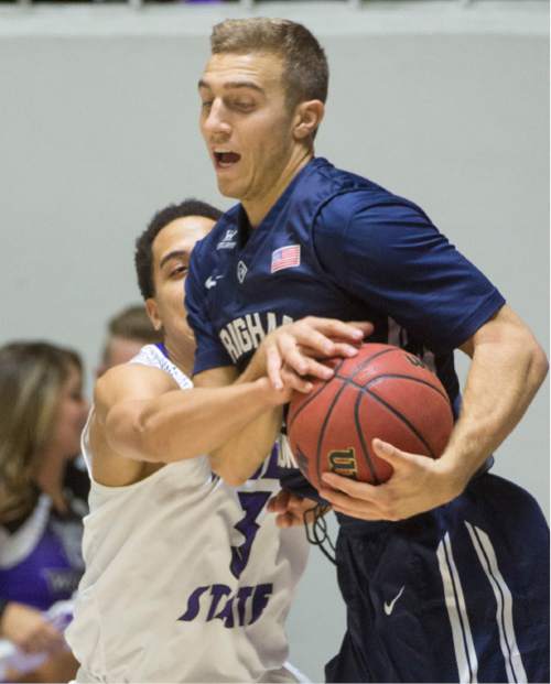 Rick Egan  |  The Salt Lake Tribune

Weber State Wildcats guard Jeremy Senglin (30) tries to grab the ball from Brigham Young Cougars guard Chase Fischer (1) in basketball action BYU vs Weber State, at the Dee Events Center in Ogden, Saturday, December 13, 2014
