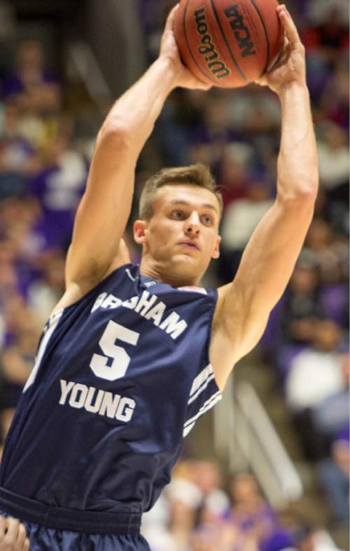 Rick Egan  |  The Salt Lake Tribune

Brigham Young Cougars guard Kyle Collinsworth (5) passes off the ball,  in basketball action BYU vs Weber State, at the Dee Events Center in Ogden, Saturday, December 13, 2014